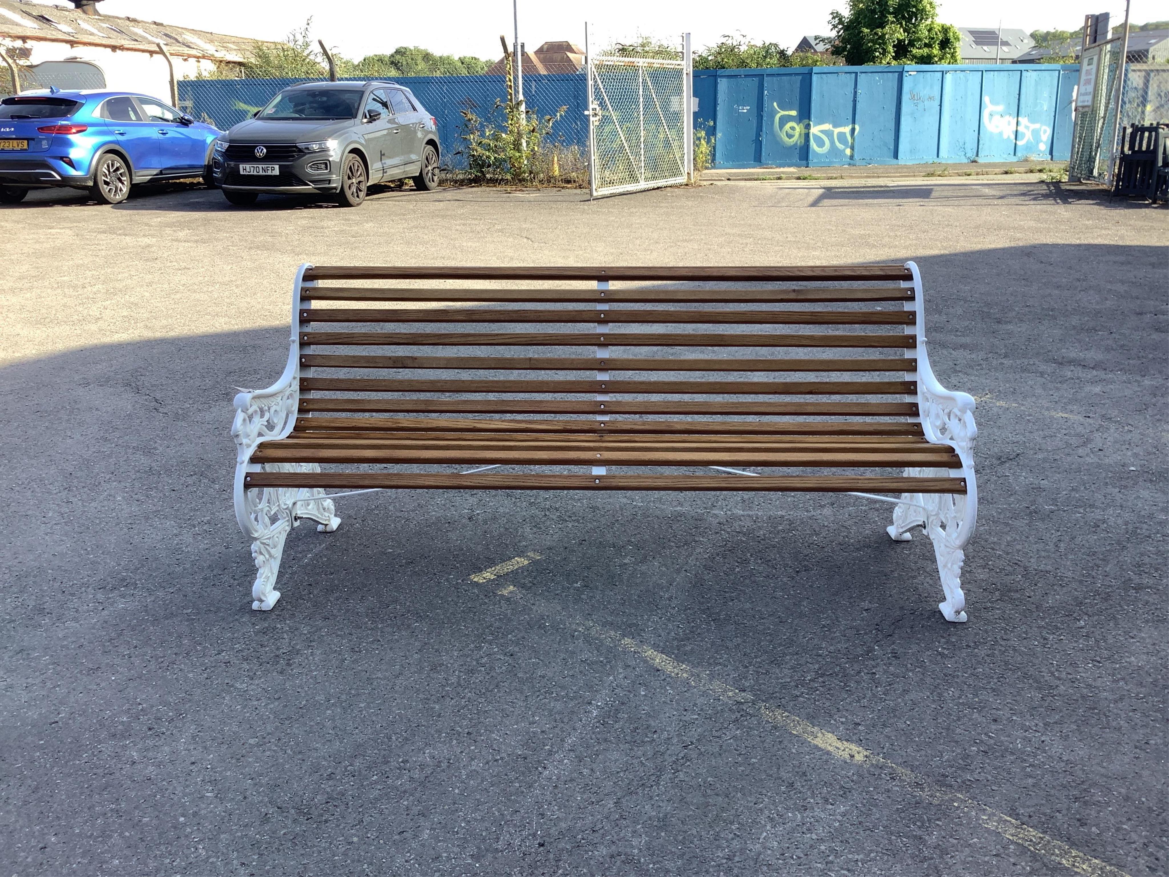 A Victorian style Coalbrookdale design cast iron garden bench (fully restored with varnished oak slats), width 178cm, depth 70cm, height 80cm. Condition - very good